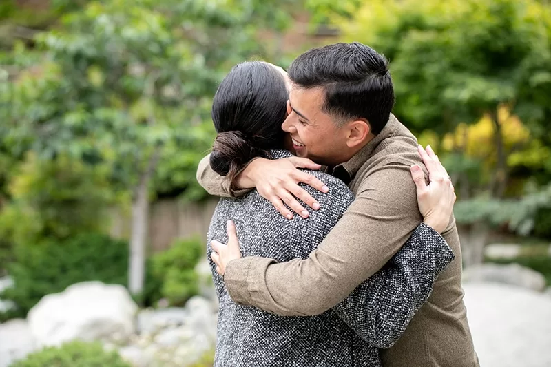 Romantic Surprise Proposal in San Diego 12 Tender embrace after the surprise proposal