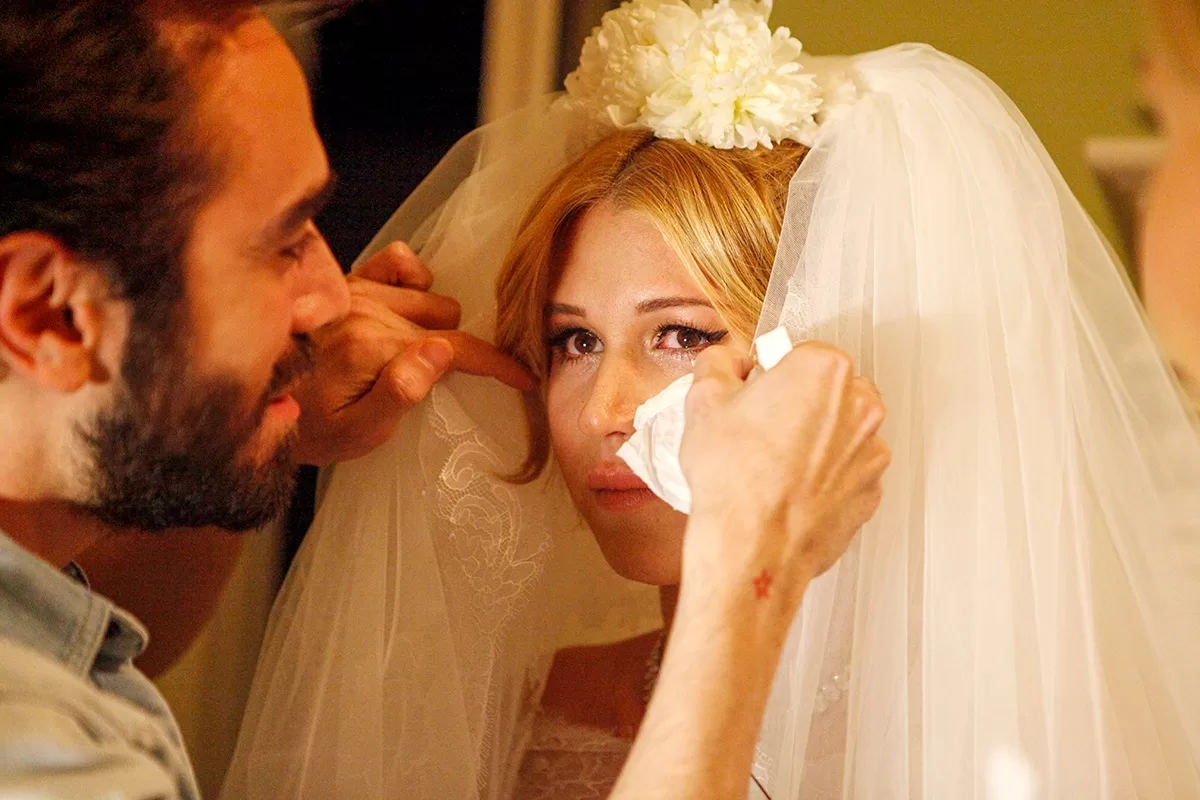 Photo captured during an emotional moment of the bride with her veil.