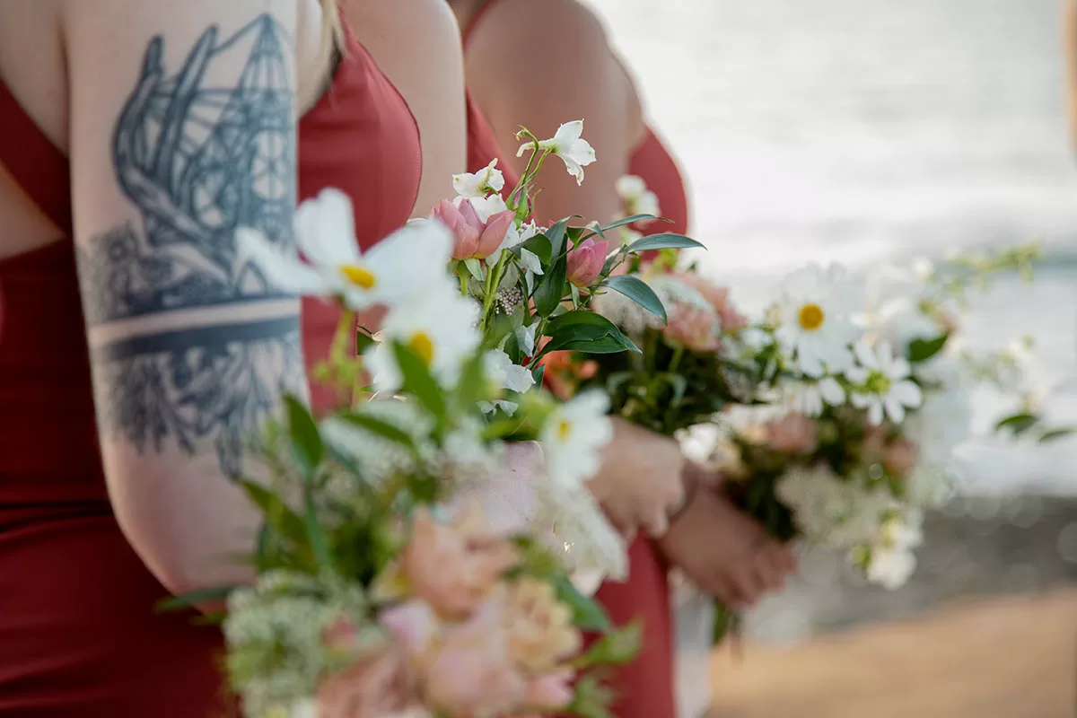 Beautiful wedding photography with bridesmaids holding flowers